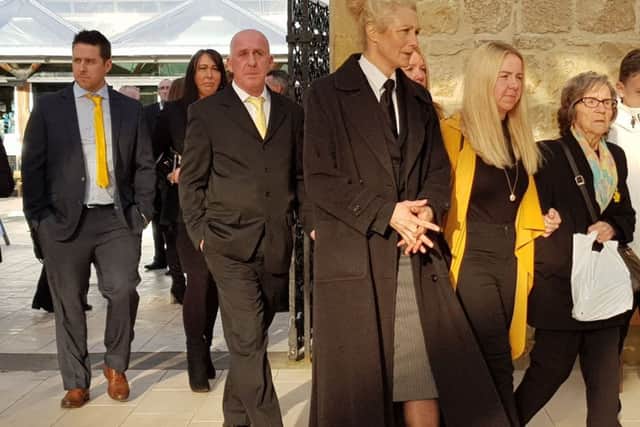 Nadine Hayes (yellow coat) arrives at the Pavilion at The Alnwick Garden for the celebration of the life of her sister Cassie.