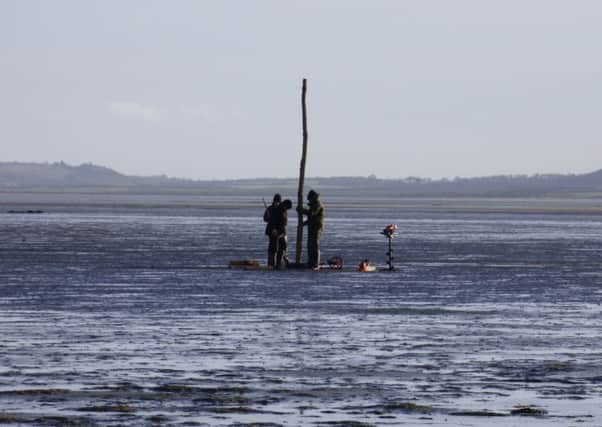 Contractors installing new poles on Holy Island causeway. Picture by Chris Pawson.