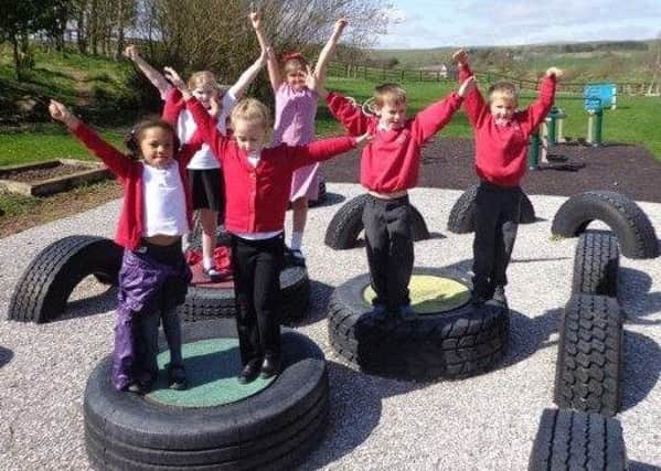 Students at Netherton Northside First School celebrate the recent Ofsted report.