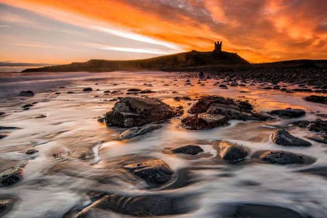 Tony Robson sunrise at Dunstanburgh Castle.