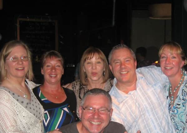 Cath and Jeff, pictured far right, with their four other siblings, Karen, Jean, Gail and Stuart (in the foreground).