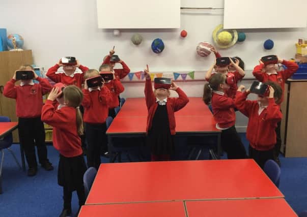 Children at Seahouses Primary School enjoy the VR headsets.