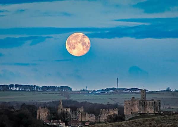 The super blue moon beside Warkworth Castle by Linda Johnson.