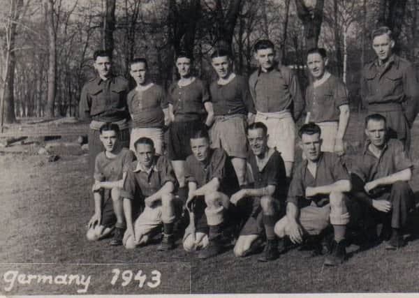 This was a propaganda photo, of the camp football team, sent home to the family as a photo-postcard. Jim is standing in the back row, third from the right.