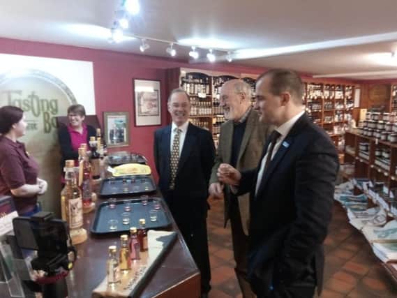 Northern Powerhouse Minister Jake Berry samples Lindisfarne Mead on a visit to Holy Island where he met Ian Robinson and Christopher Walwyn-James.