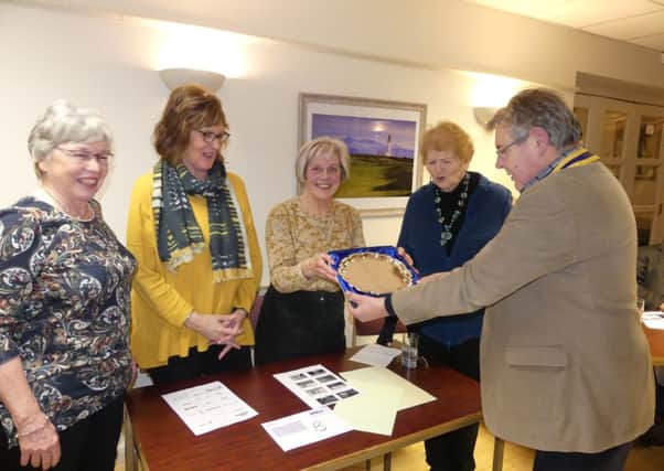 The winning team from Morpeth Inner Wheel Shona Ritchie, June Hudspith, Vivien Scott and Suzanne Hamnett, being presented with the silver salver by Rotary President Peter Scott, at the Three-Way Quiz.