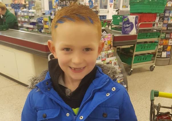 Junior Lockey collects his reward from the staff at Morrisons for his good deed.
