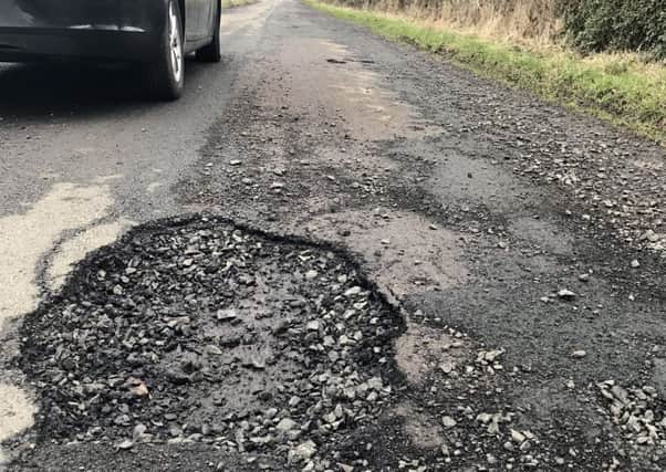 A pothole on the road between the A1 and the A697 near North High Moor Farm.