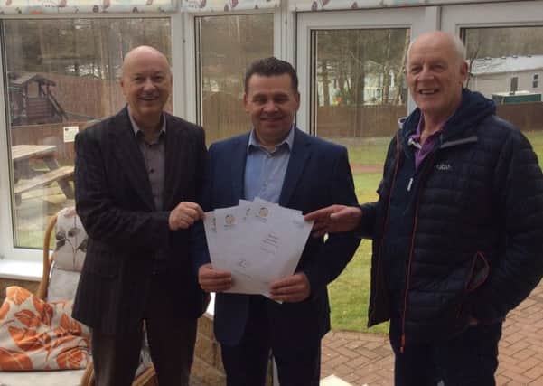 Andy Gibb (centre), from Percy Wood Golf and Country Park, with members of the Alnwick Garden Town Trust.