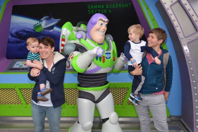 Bertie, brother Sebastian and parents Claire and Gemma meet Buzz Lightyear at Walt Disney World.