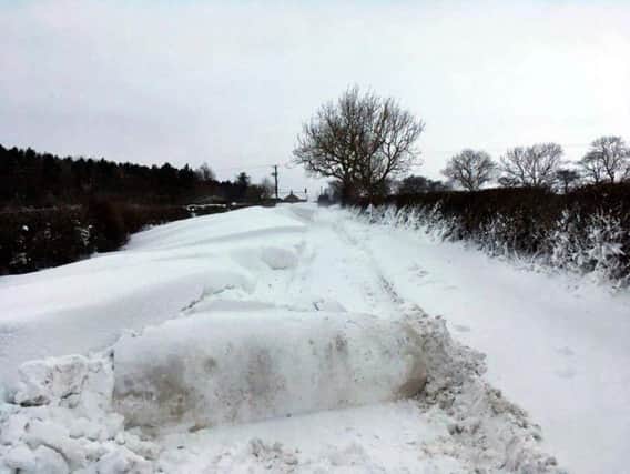 The snow-bound road into Whitehouse Farm, near Morpeth.