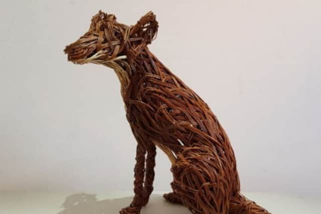 A willow sculpture of a fox, by Anna Turnbull from Biteabout Arts.