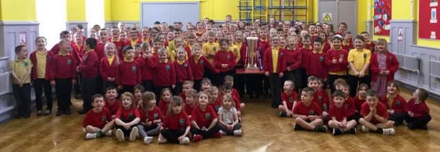 Shilbottle Primary School pupils with the Super League trophy.