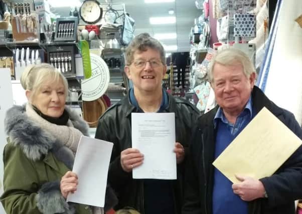 Maureen Hornsby, Philip Angier and Geoff Proudlock with letters of objection and the petition.