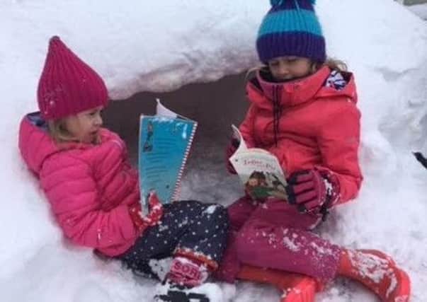 Whittingham pupils Olivia and Eliza chose to read their books next to their snow hole, with hot chocolate to keep them warm.