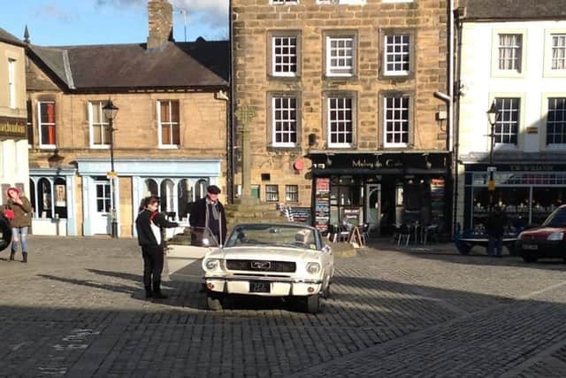 Roo Irvine and James Braxton in Alnwick with the Ford Mustang.