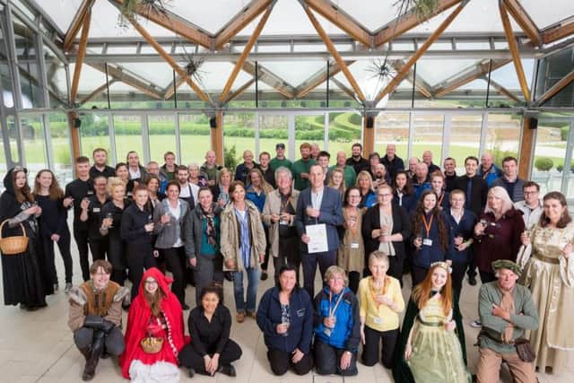 Staff at The Alnwick Garden celebrate winning best large visitor attraction at the Northumberland Tourism Awards.