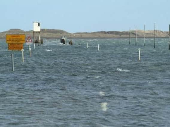 How the causeway becomes submerged at high tide. The white refuge box on stilts can be seen on the left. Picture by HM Coastgard