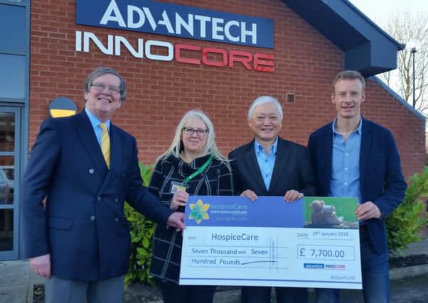 John Swanson and Sue Gilbertson, from HospiceCare North Northumberland, with Chaney Ho and Edward Price, of ADVANTECH