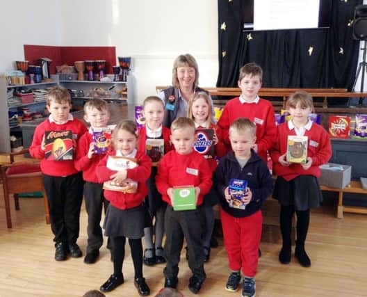 Belford First School held a decorated Easter egg competition.
The Coop in Belford kindly donated the prizes for first, second and third for each class.
Pictured is Carol Johnson (manager of  Belford Coop) with the winners with their prizes.
