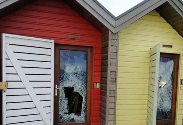 The damage to the doors of two of the beach huts. Picture by Robert Ferry.