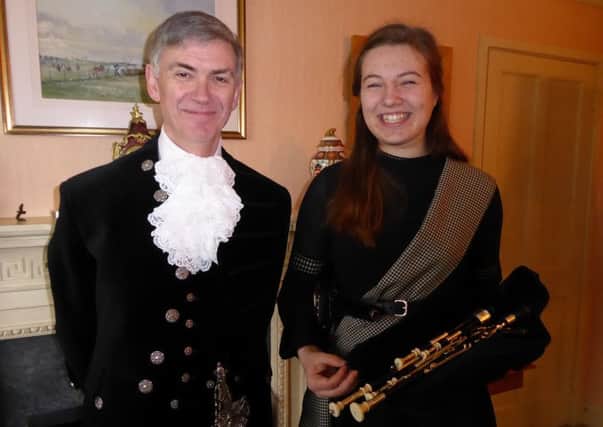 The new High Sheriff of Northumberland, Michael Orde, with Issy Maxwell, his piper for his shrieval year.