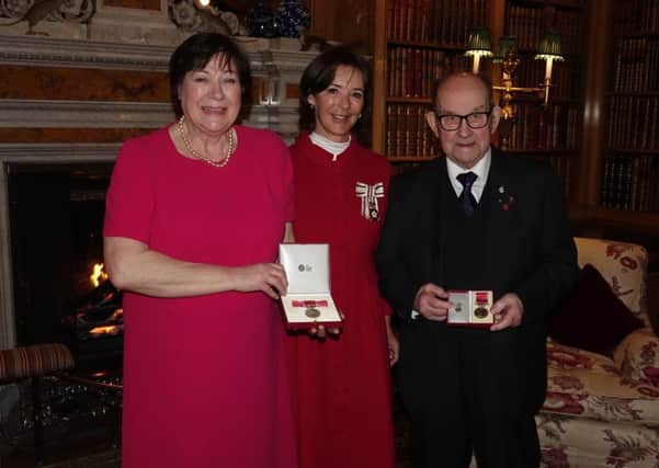 Jean O'Hanlon and Frank Bull receiving their BEM from the Duchess of Northumberland.