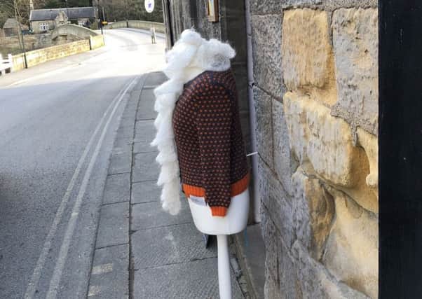 The mannequin outside Rainbow Yarns, pictured at the end of March.