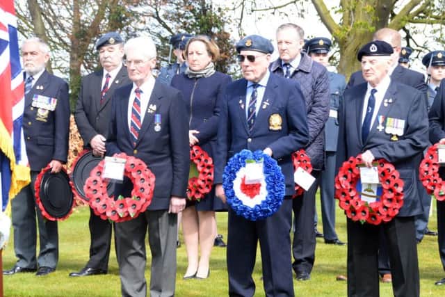 Representatives with wreaths.