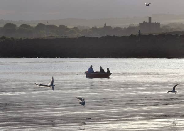 View Warkworth castle from Amble harbour