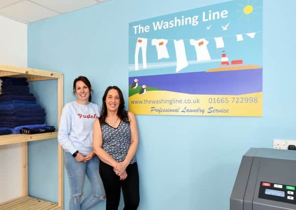 Pictured inside laundry service The Washing Line, Seahouses, are customer Sarah Patterson, left, and laundry technician Cleo Gregory.