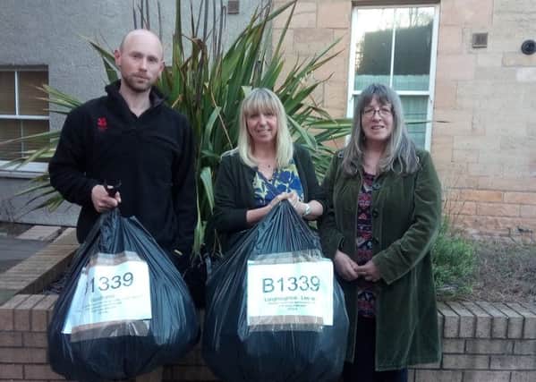 Alnwick Area Friends of the Earth campaigners, including Peter Edge, with the bags of litter they collected from the roadside along the B1339.