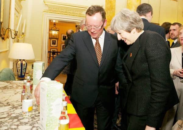 Council leader Peter Jackson shows the Prime Minister some Northumbrian products.