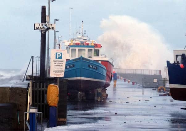 Big waves during a tidal surge at Seahouses harbour  Picture by Jane Coltman