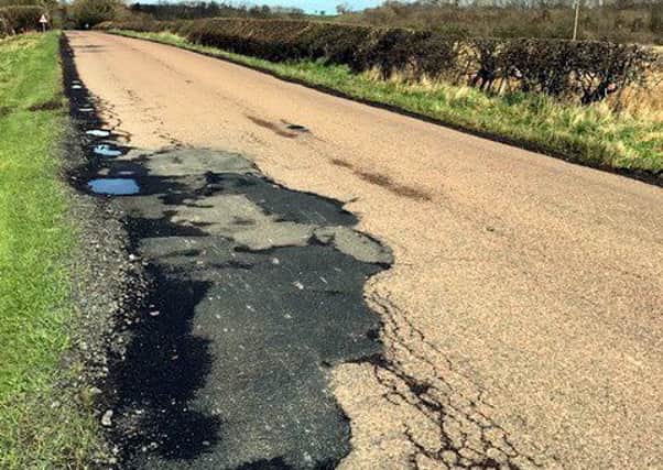 Potholes in the road from the north of Longframlington village to Newton on the Moor.