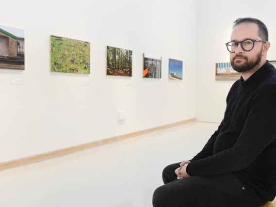 Narbi Price with his new exhibition at Woodhorn Museum. Picture by Jane Coltman