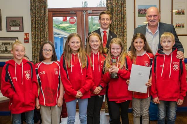 Morpeth junior swimmers collect their award. Picture by Darren Turner.