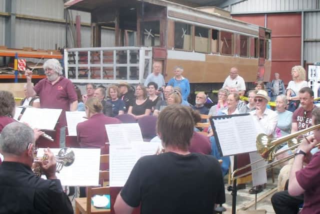 The Alnwick Playhouse Concert Band entertains the crowds in the engineering shed at the Aln Valley Railway.