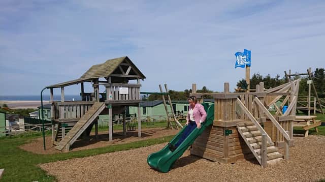 Berwick MP Anne-Marie Trevelyan tries out the slide at Waren Caravan Park.
