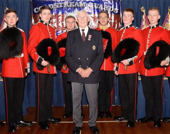 Jock Law was presented with his BEM after taking part in the Coldstream Guards March through the town to mark the 50th anniversary of the regiment receiving the freedom of the burgh.