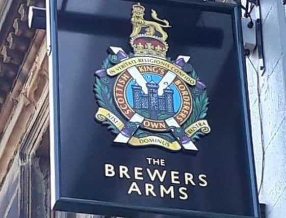 The KOSB coat of arms on the sign at The Brewers Arms in Berwick.