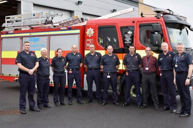 Northumberland firefighters and Cllr Riddle with one of the new appliances.
