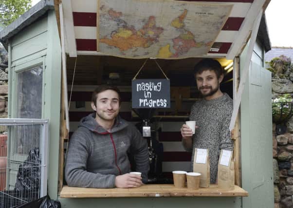 Tom and Andrew Mundy ground coffee in their Holy Island shed. Picture by Jane Coltman