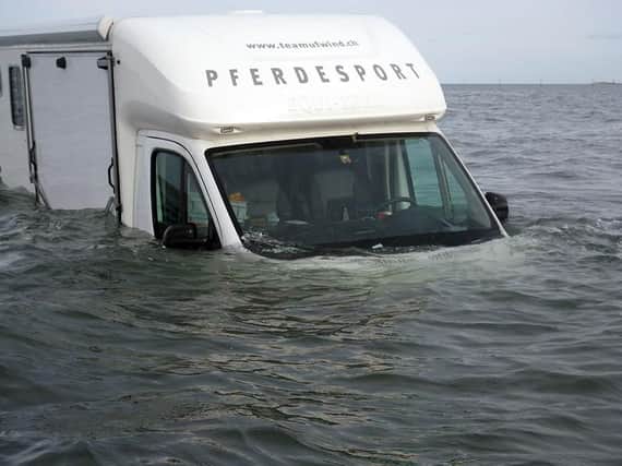 The partially submerged van on Holy Island causeway.