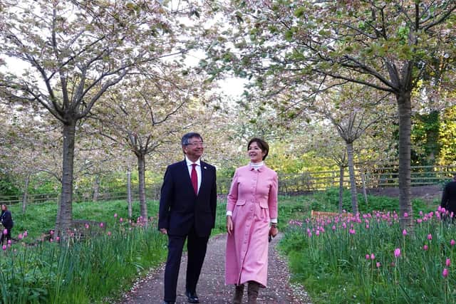 The Japanese Ambassador and the Duchess of Northumberland walk through the Cherry Orchard at The Alnwick Garden. Pictures and video by Jane Coltman
