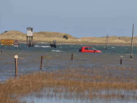 The car on the causeway. Picture by Dave Siggens