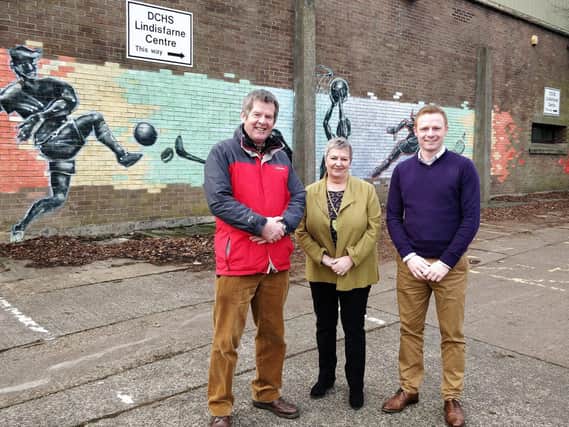 County councillors Robbie Moore and Gordon Castle and Lynda Wearn at the school site.