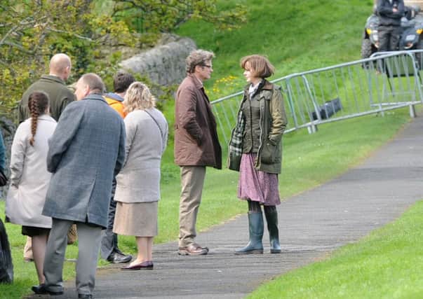 Colin Firth and Nicole Kidman amongst film crew and extras take a stroll along Berwick's walls while filming an adaptation of Eric Lomax' The Railway Man.