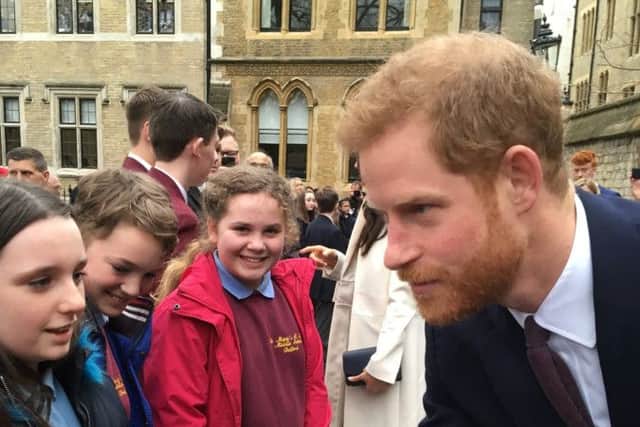 Pupils from St Mary's CofE Middle School in Belford meet Prince Harry at the Royal Commonwealth Service at Westminster Abbey.